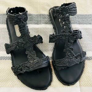 Melissa - Campana Barroca Gladiator sandals in black with silver hardware.